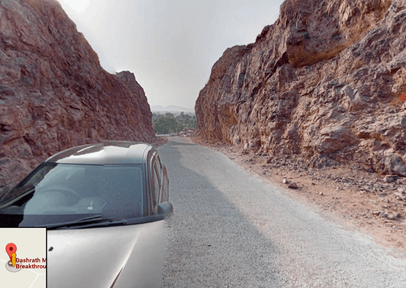 Google Street view showing the road that cuts through the mountain to get to Gehlaur, India.