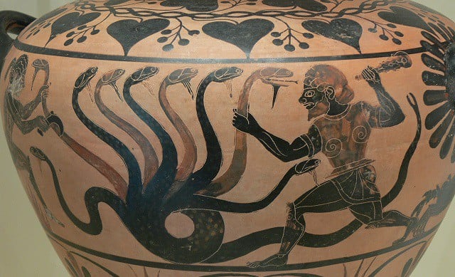 Photo of Greek/Roman era vase depicting a man fighting a multi-headed snake.